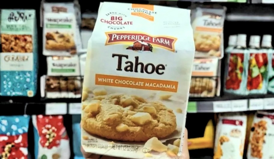 a hand holding a bag of tahoe cookies