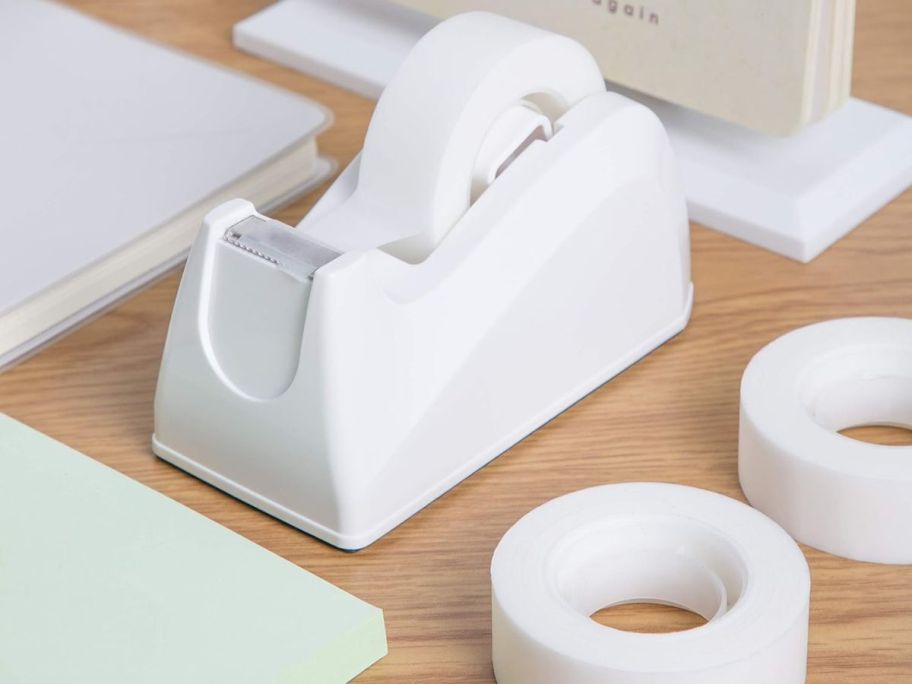 tape dispenser with tapes on the table