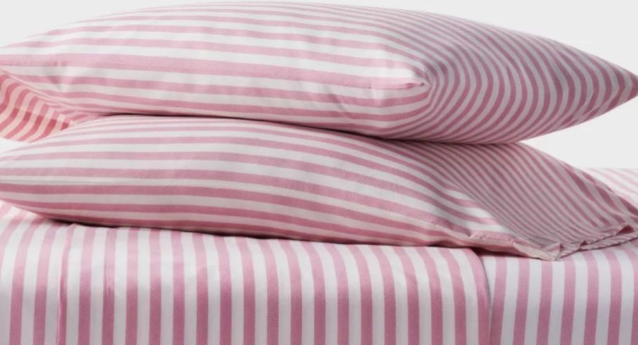 two pillows with stripped bedding