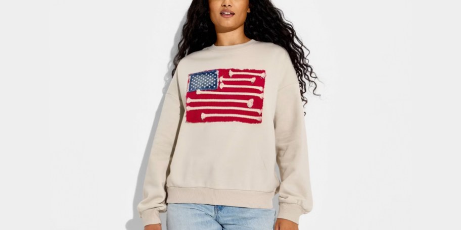 girl wearing flag sweatshirt
