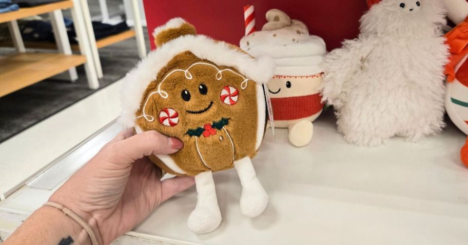 hand holding Gigglescape Mini Gingerbread House Plush