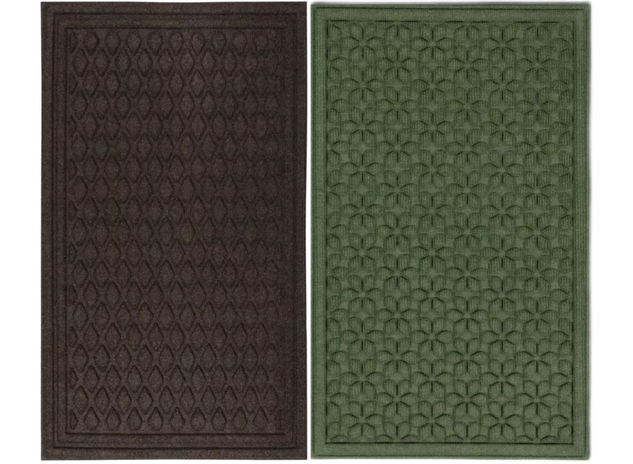 Two textured rectangular rugs side by side; the left one is dark brown with a diamond pattern, and the right one is green with a floral design.