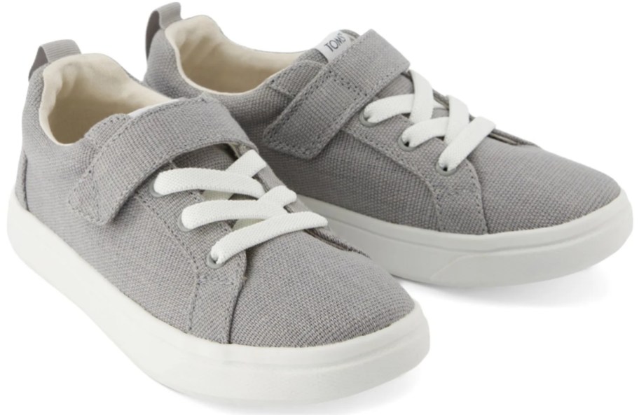 a pair of gray kids sneakers