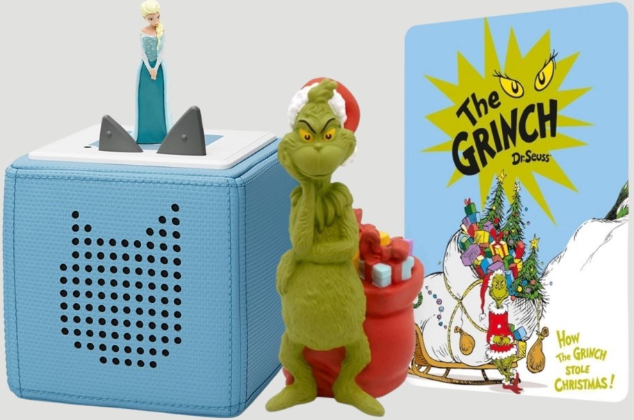 a tonies box with elsa from frozen and a grinch tonie figurine