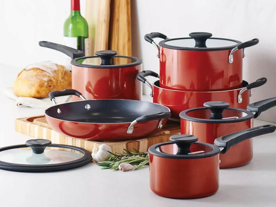 red and black cooking utensils on the table