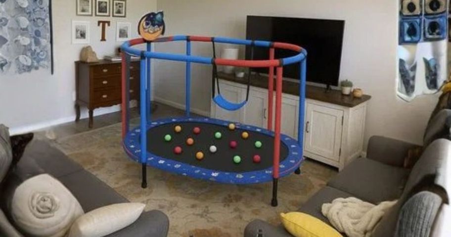 blue toddler trampoline in living room