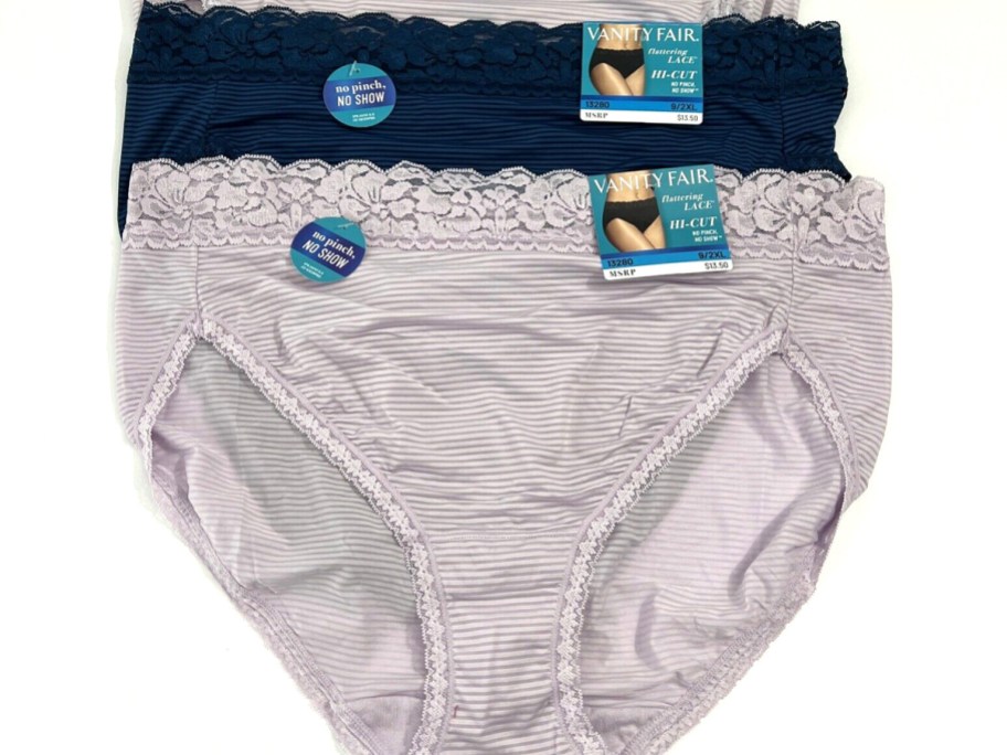 gray and blue vanity fair underwear laying on table