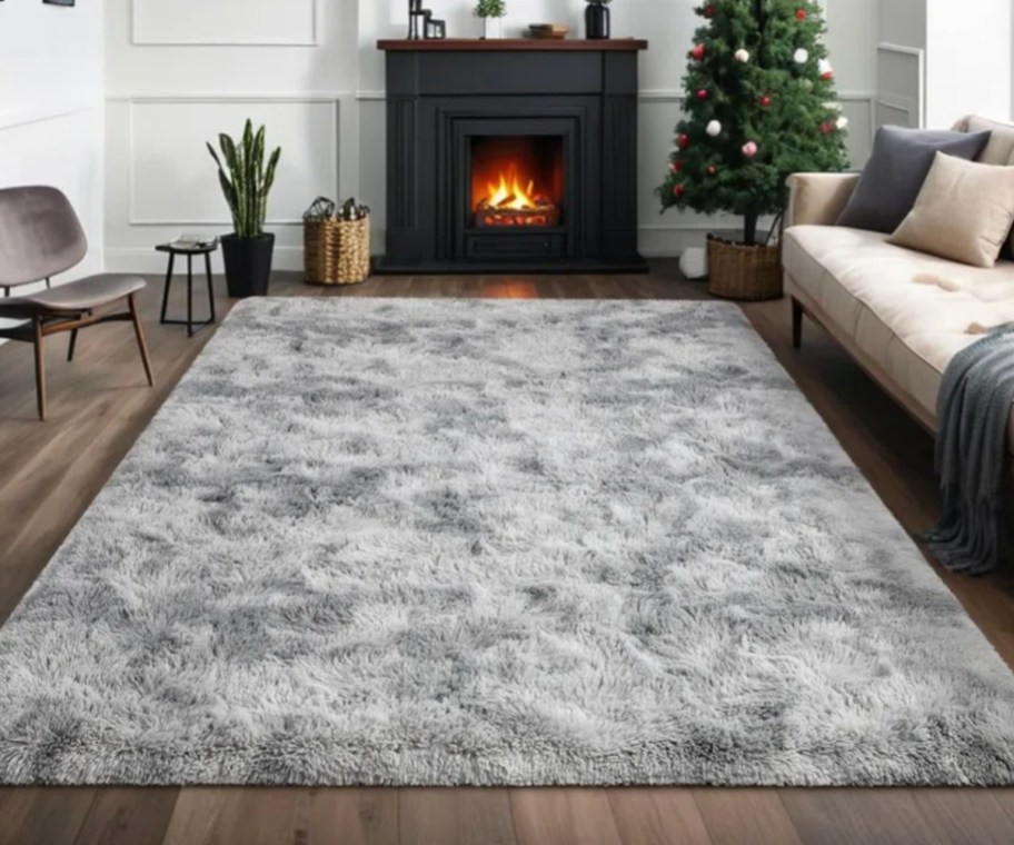 grey shag rug near christmas tree and couch