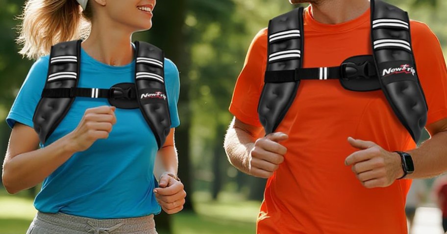two people wearing weighted vests while jogging