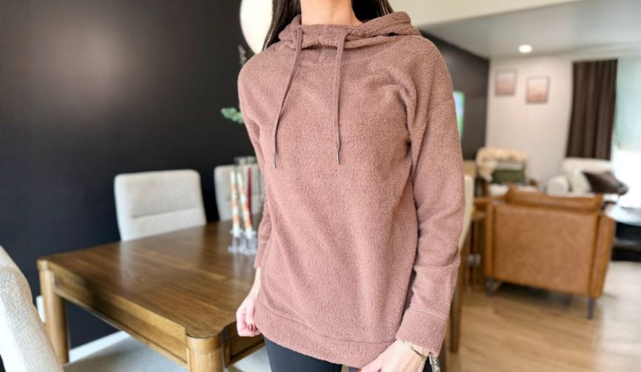 woman wearing a pink hoodie