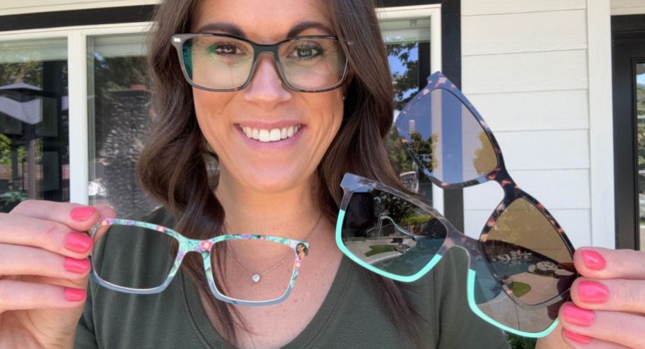 Woman holding three different pair of glasses on her hands