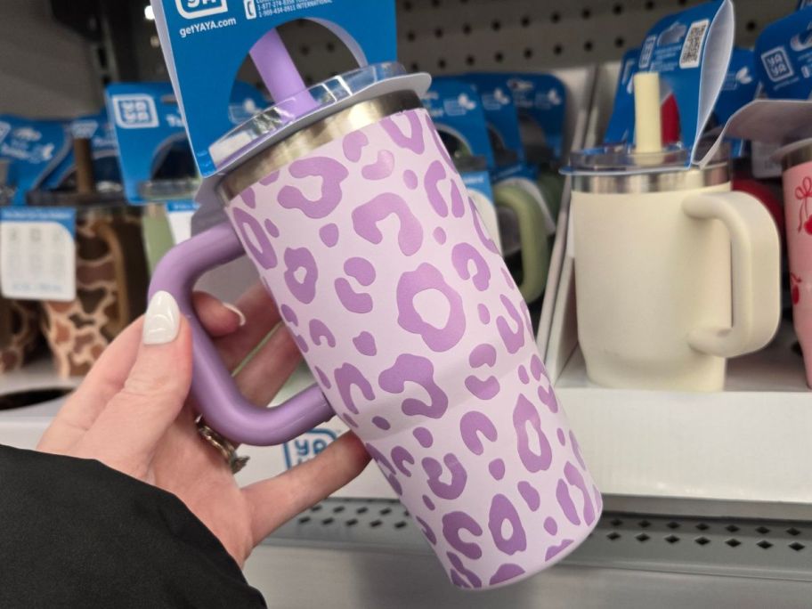 hand holding yaya tumbler with leopard print on it in store