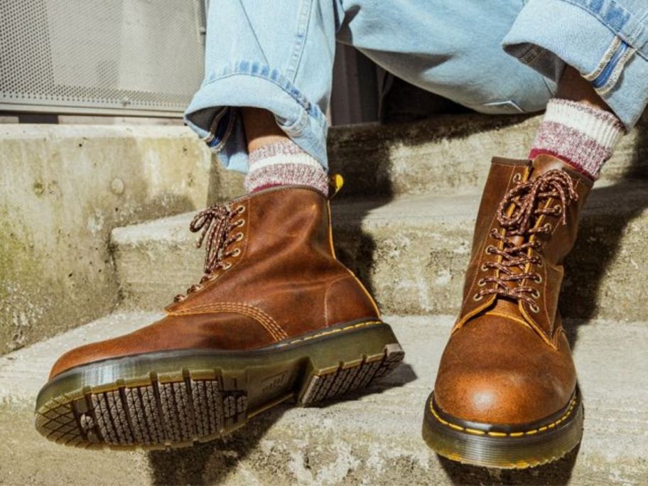 A man wearing brown leather boots