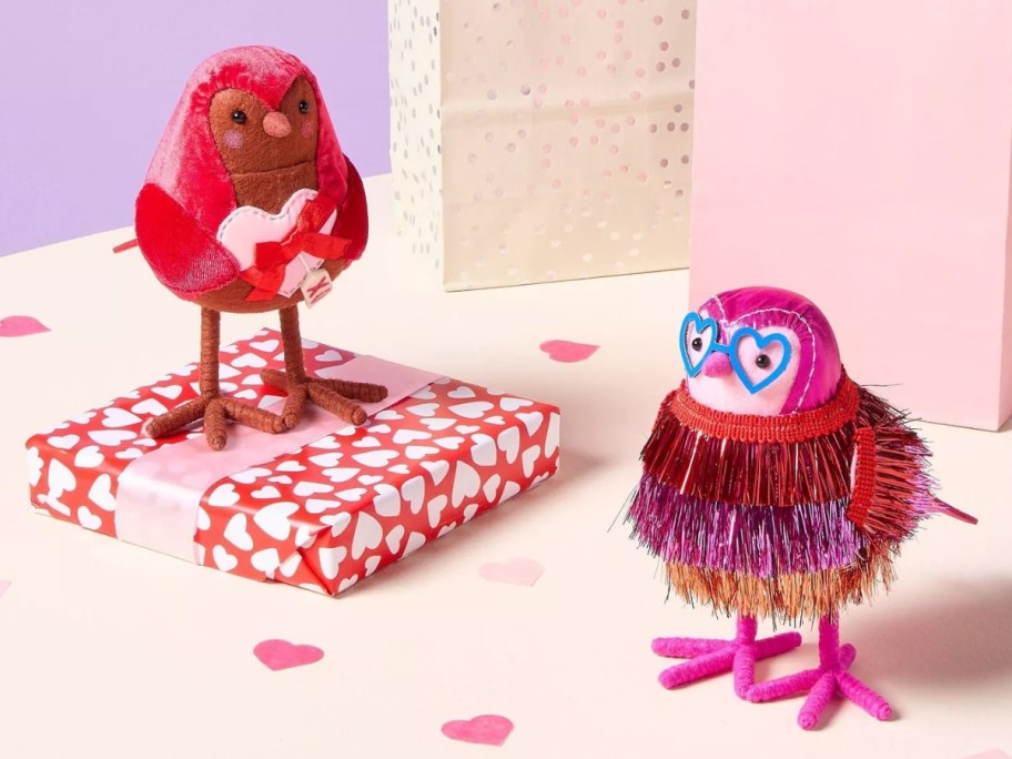 two Valentine's Day themed bird figures with Valentine's presents around them