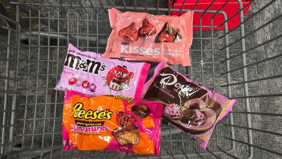 bags of Valentine's M&M's, Hershey Kisses, Dove Chocolates, and Reese's Hearts