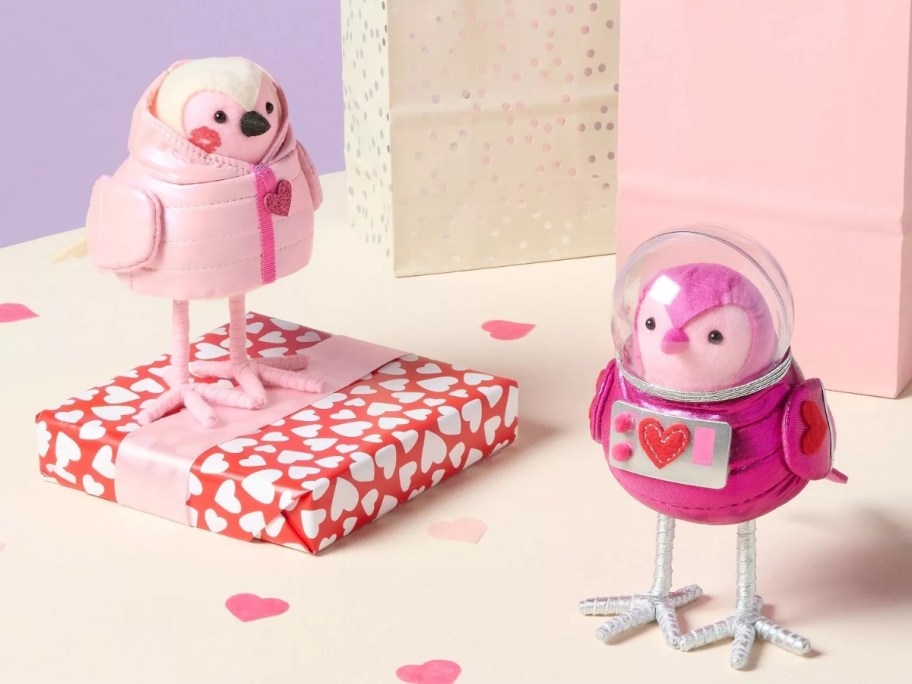 two Valentine's Day themed bird figures with Valentine's presents around them