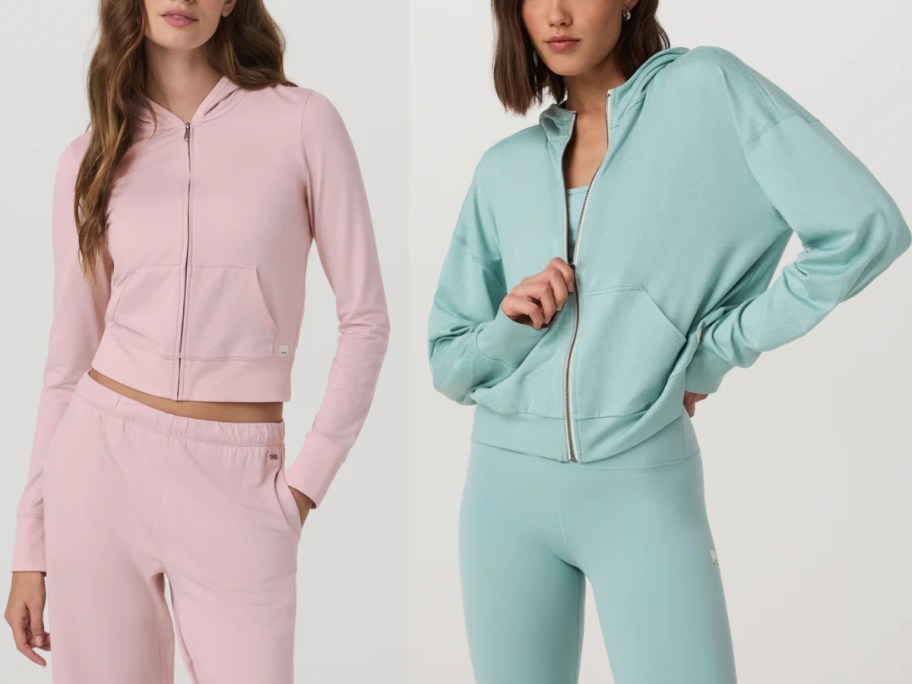 two women in zip up hoodies