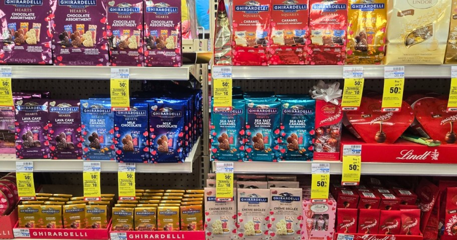 bags of Lindor and Ghirardelli candies on a store shelf