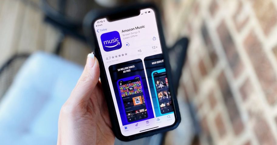 Hand holding a phone with Amazon music unlimited