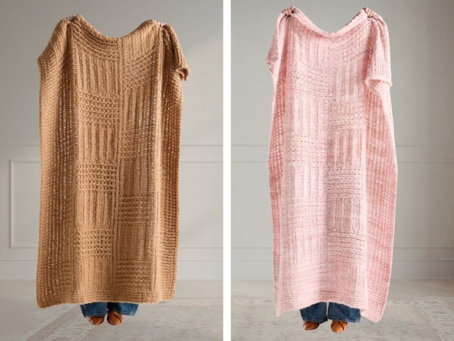 two people holding blankets in front of them in brown and pink