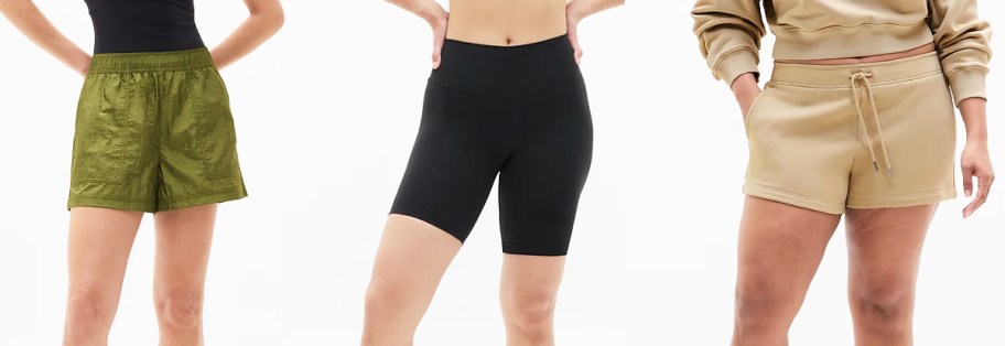 three women in green, black, and tan shorts