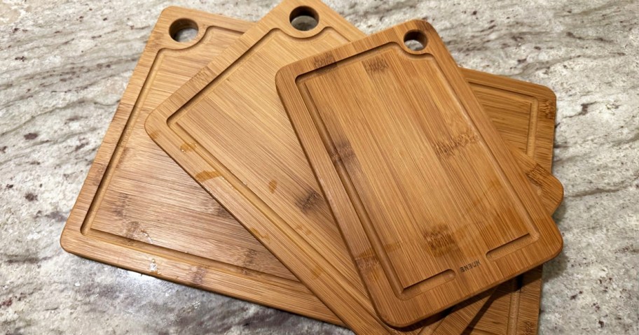 stack of 3 bamboo cutting boards on a counter