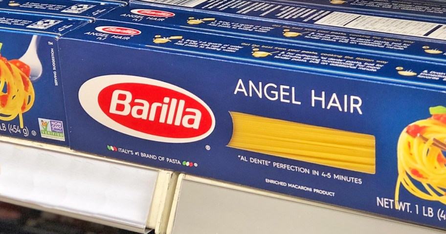 blue boxes of Barilla Angel Hair Pasta on store shelf