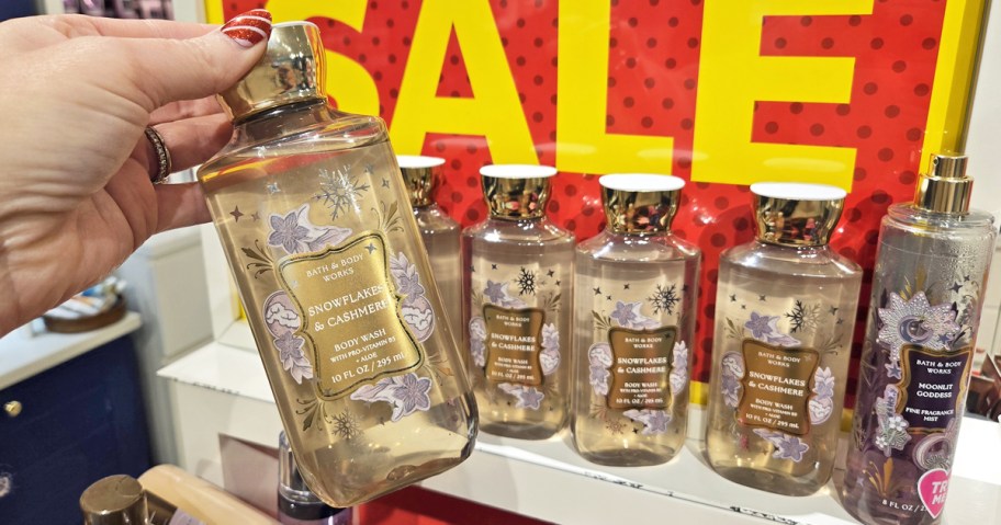 hand holding up a bottle of Bath & Body Works Body Wash