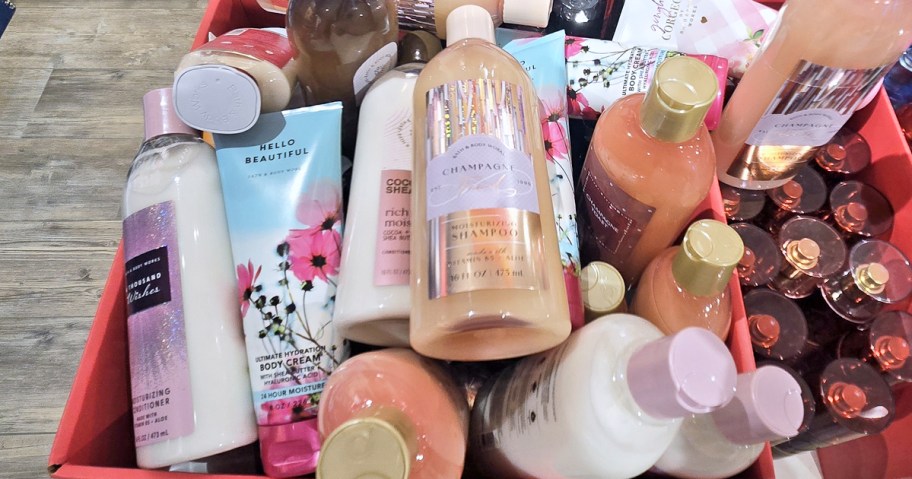 box full of shampoo, conditioner, and body cream bottles