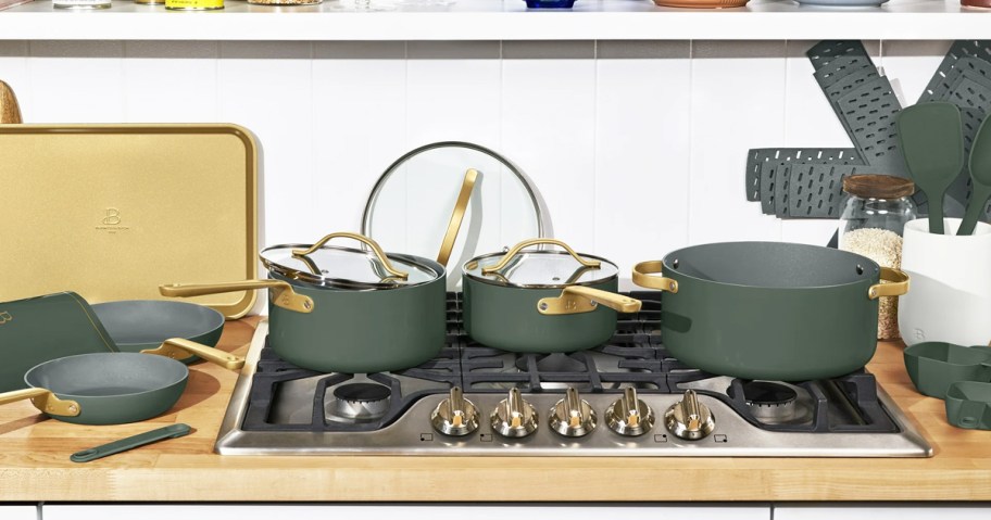 green and gold cookware set on a stove