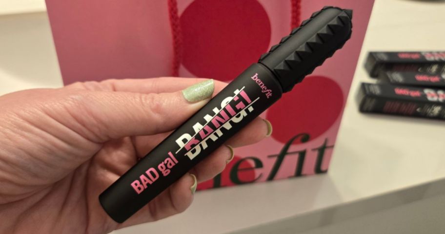 Hand holding a Benefit BadGal Mascara