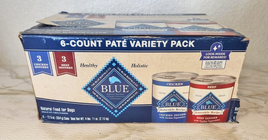 Box of blue buffalo dog food cans on counter