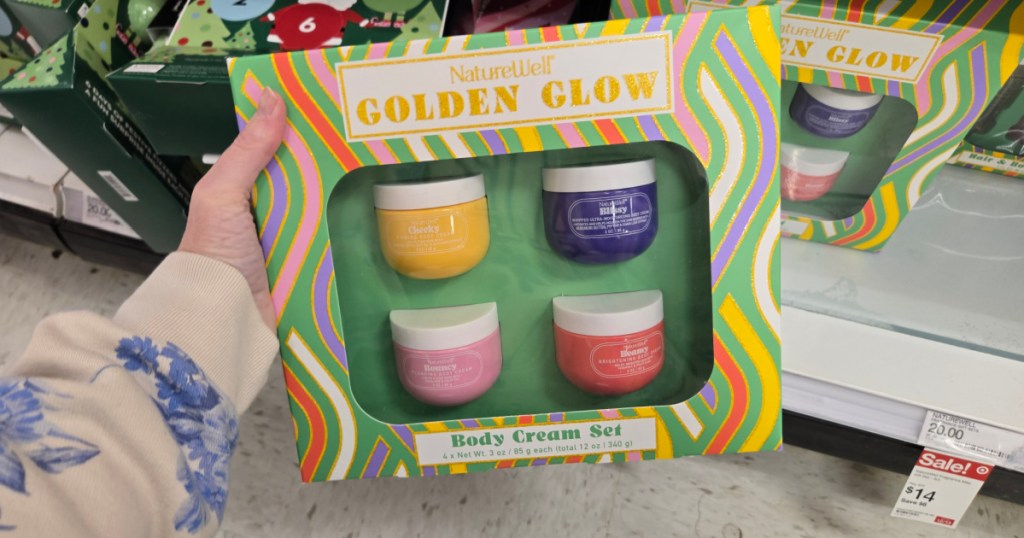 woman holding naturewell Body Cream Set in target