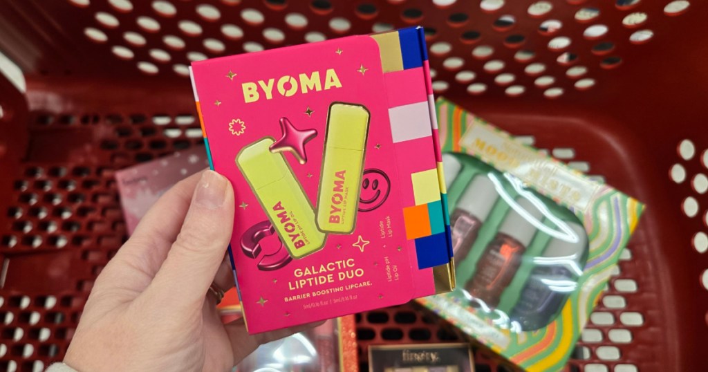woman holding Byoma Liptide Duo in target store