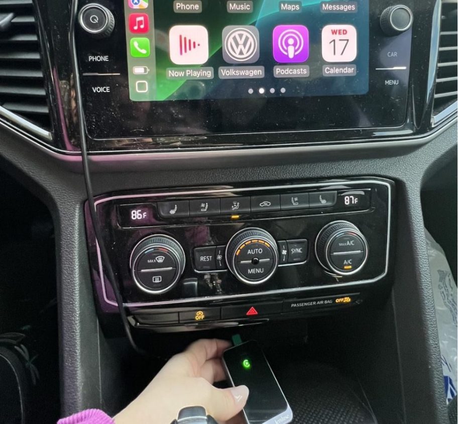 A Jemluse Carplay Adapter plugged into a car console