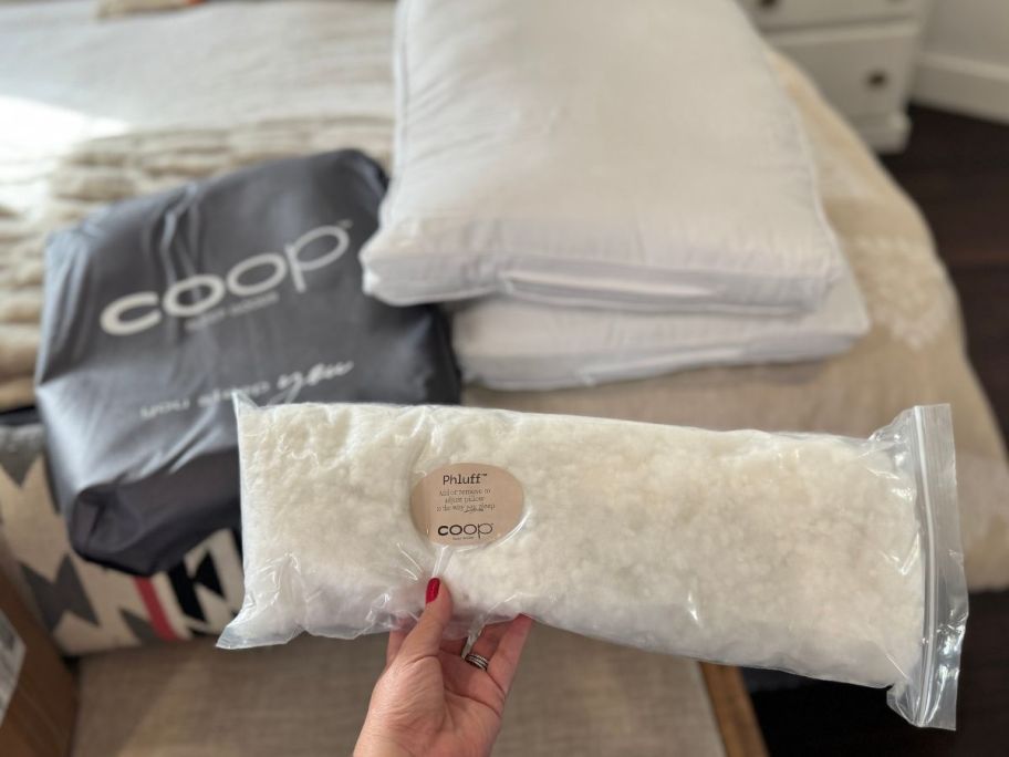 2 Coop Pillows with a bag of extra filling