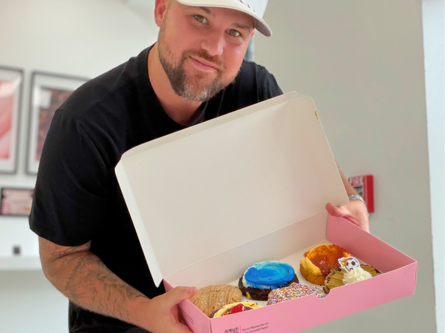 Crumbl cookie with man holding box