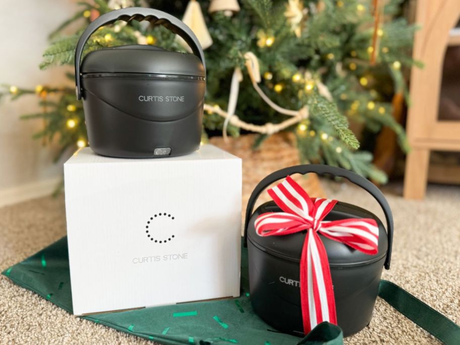 Two Curtis Stone Portable Food warmers in front of a Christmas Tree
