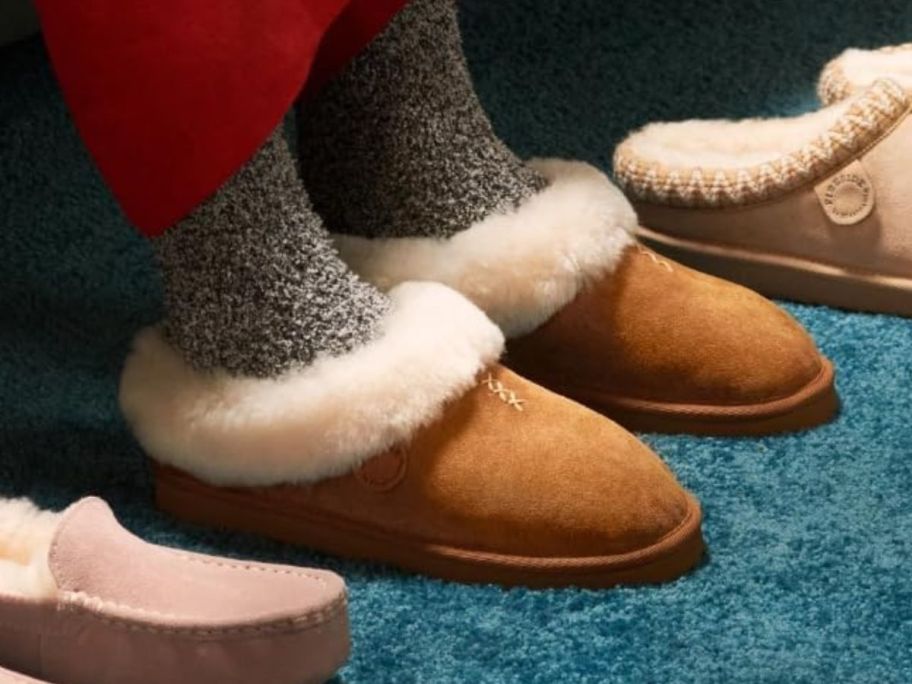 Woman's feet wearing dearfoams adelaide fireside slippers