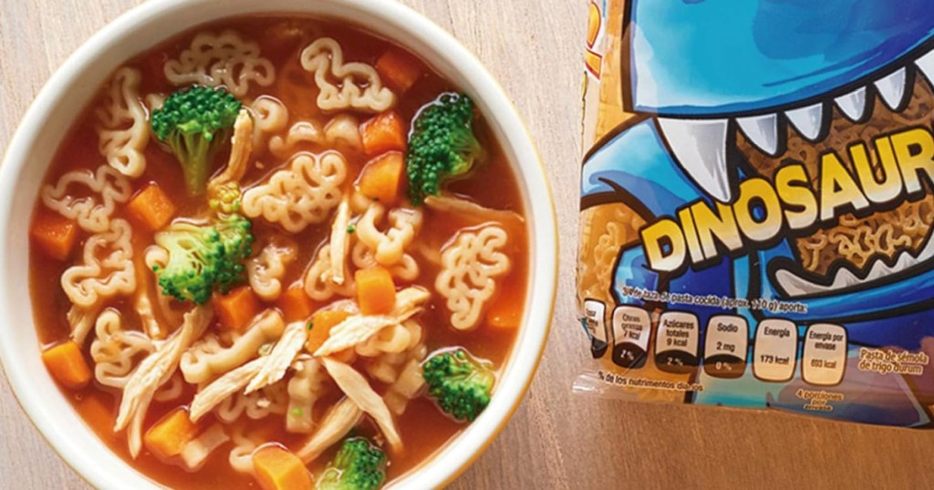 Bowl of dinosaur shaped pasta with soup broth