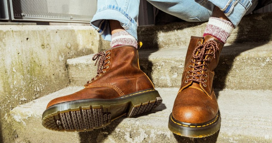 man wearing brown leather boots
