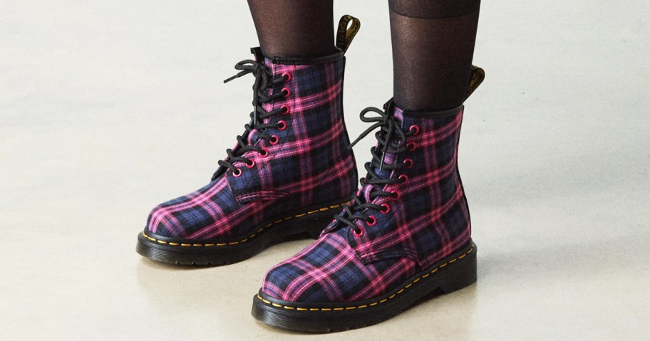 woman wearing pink and blue plaid boots