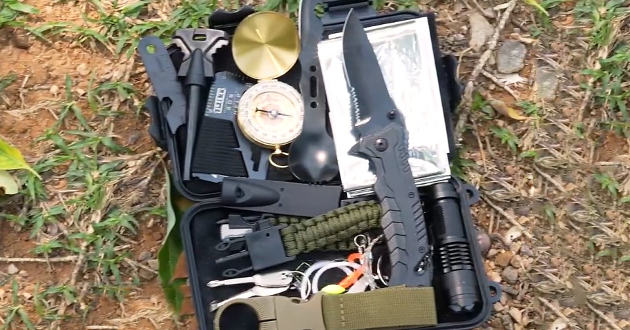 opened survival kit on the ground