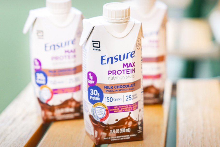 Ensure Max Protein Shakes on wood table