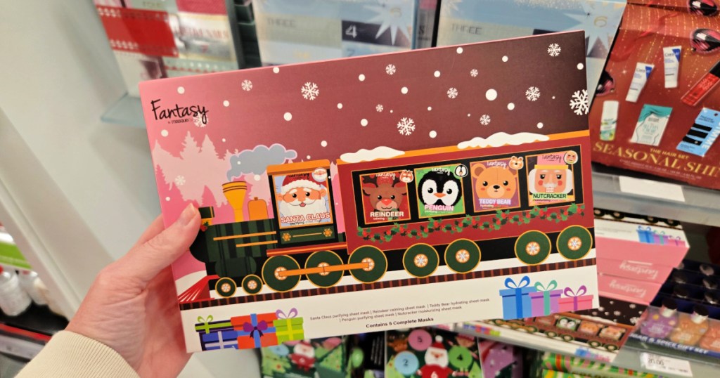 person holding Fantasy by Masque Bar Santa Train Gift Set in target store
