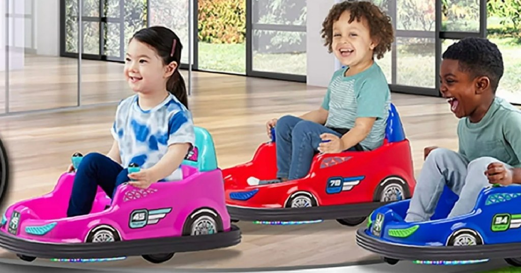 Three kids riding bumper cars inside house