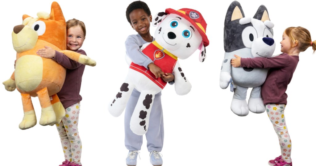 Boy and girls holding giant, plush in hand