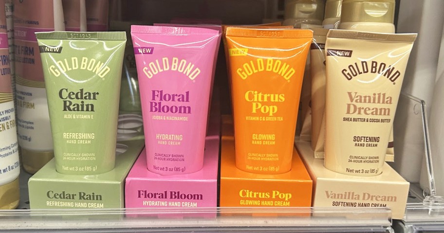 colorful bottles of Gold Bond hand creams on store shelf