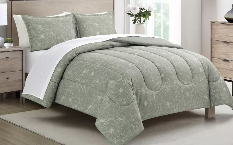 green bedding displayed on a queen size bed 