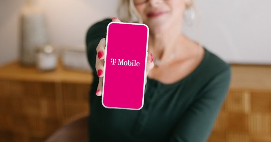 woman holding a phone with T-Mobile on it